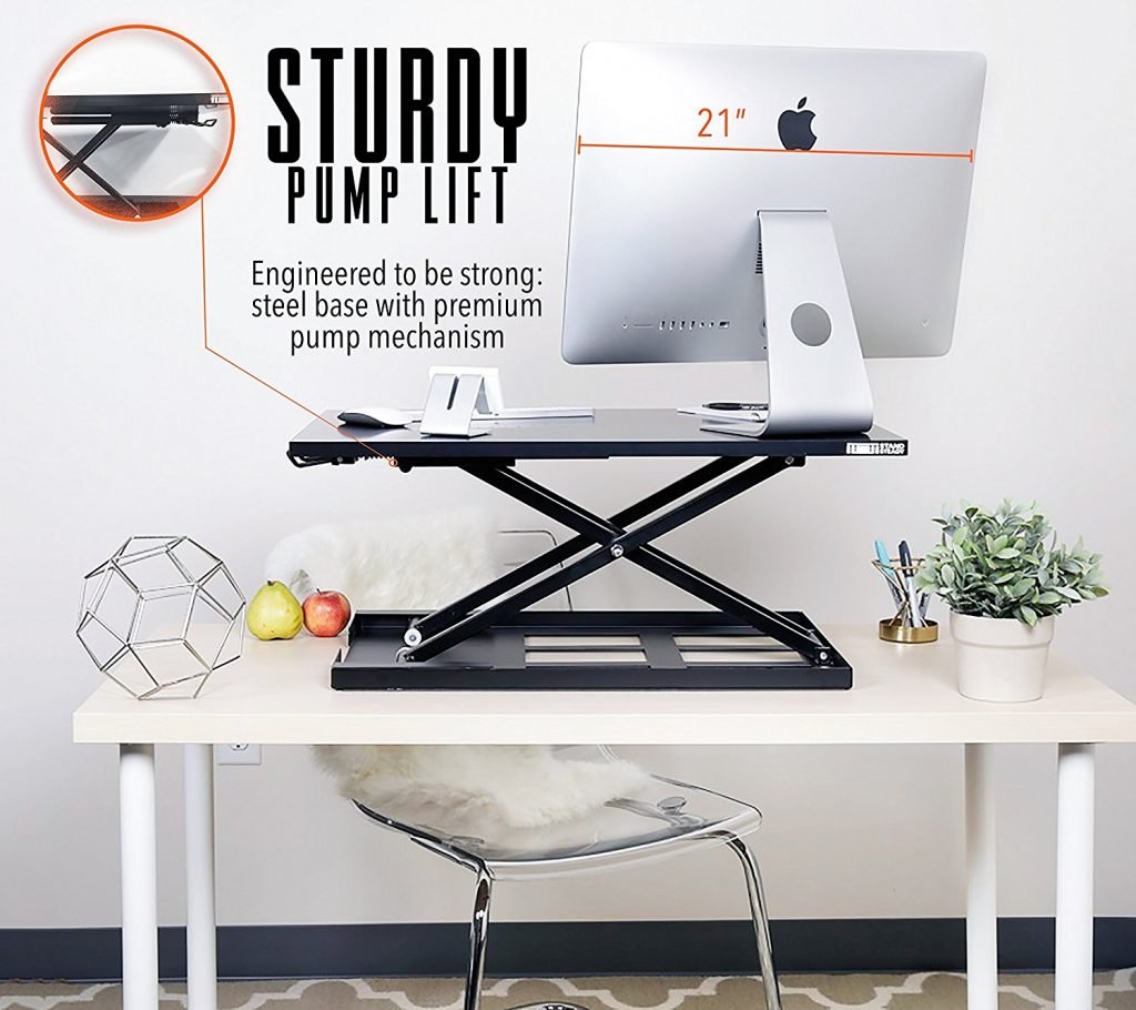 image of the standing desk with imac and displaying 21" on the image. the image shows pump lift technology on the elite pro