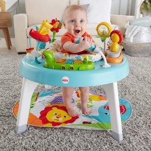 fisher price toddler playing in activity center listening to music