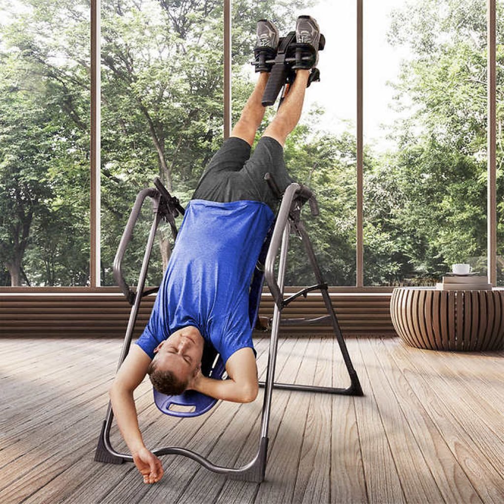 man using the inversion table 45 degrees