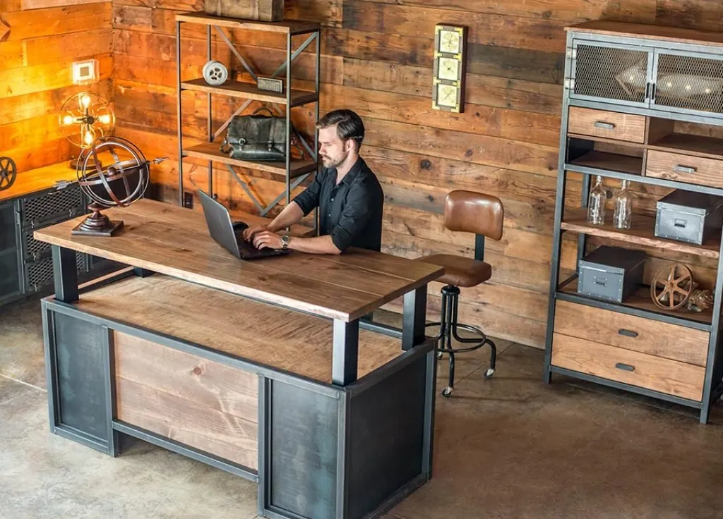 man working on an xdesk vintage stand up desk