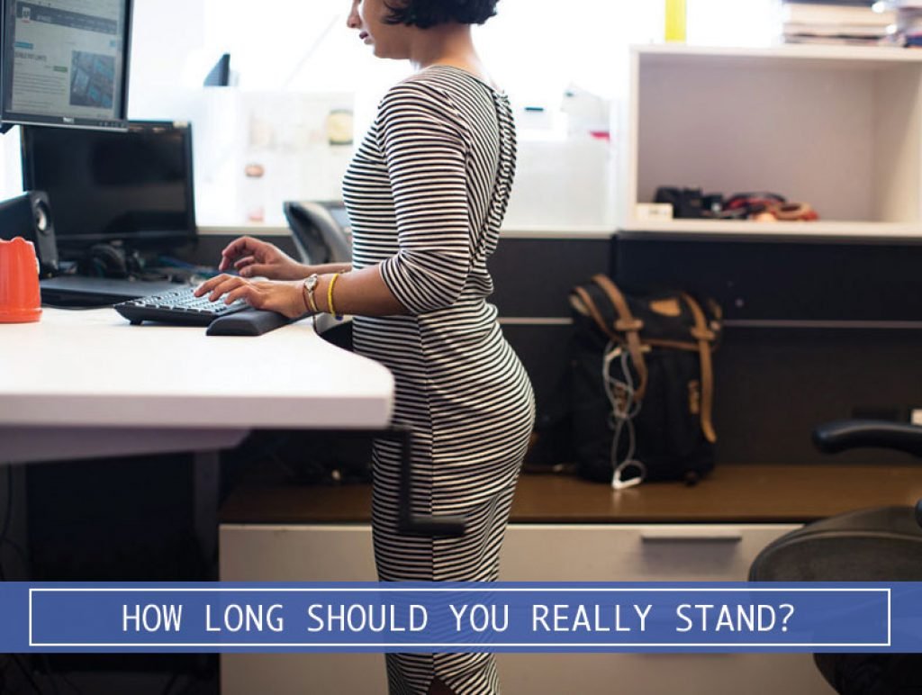 woman working on a computer at a stand up desk