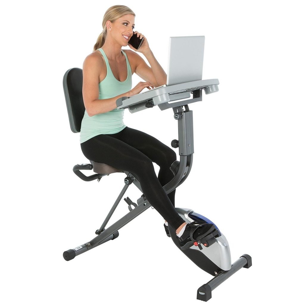 woman on the phone using the exerpeutic workfit 1000 exercise bike