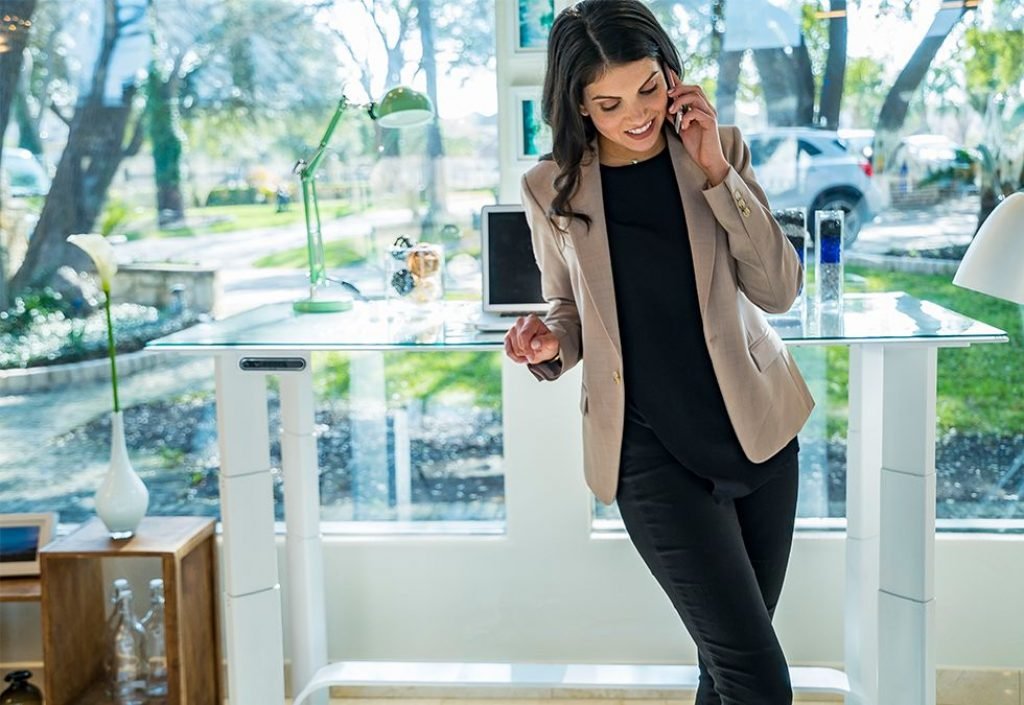 woman with the xdesk air clear stand up desk