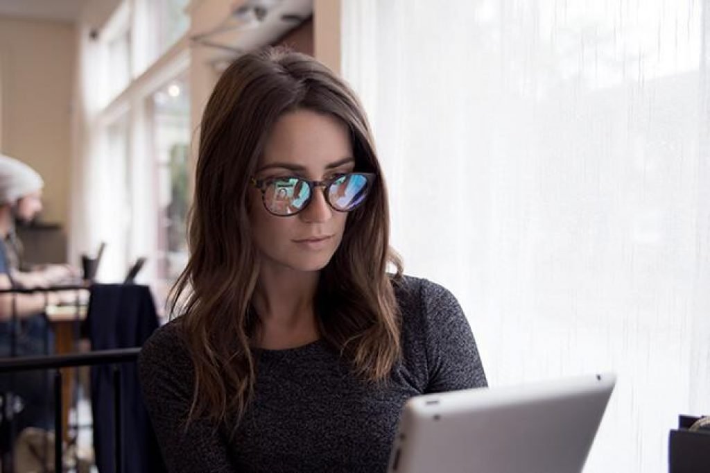 woman wearing protective computer glasses