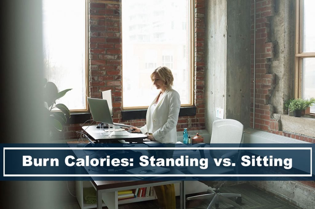 lady standing while working, using a sit to stand desk converter